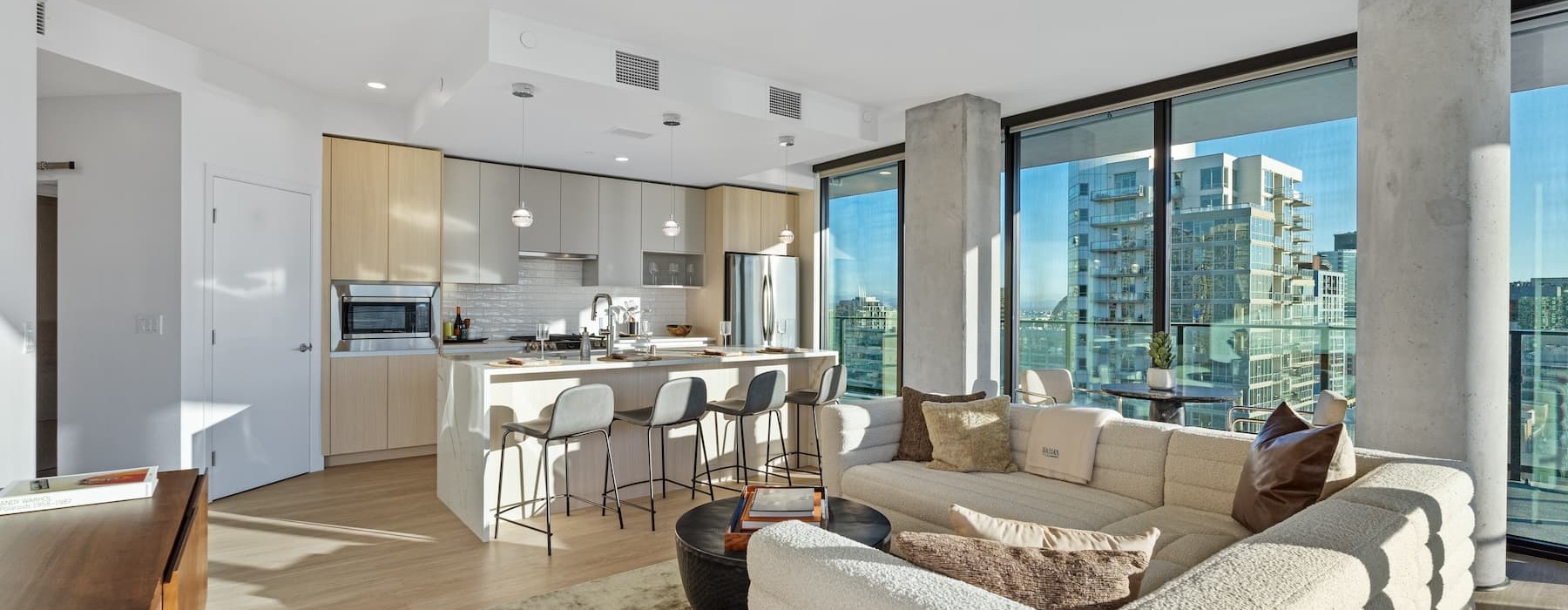 living area that includes ample seating spaces and bright lighting